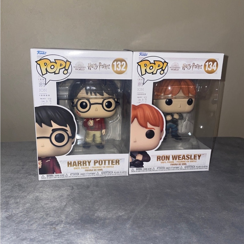 Funko Pop 132 and 134 Harry Potter with the stone and Ron weasley